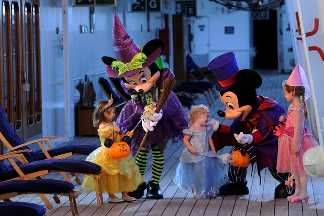 Mickey and Minnie with costumed children 